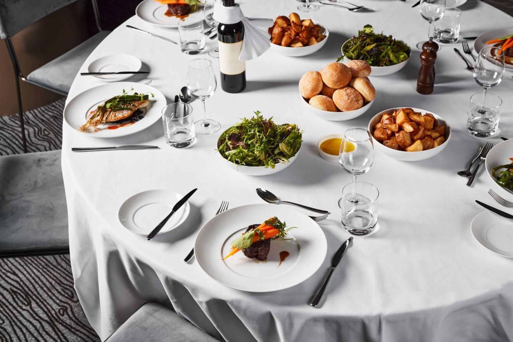 Melbourne Marriott Hotel Docklands Buitenkant foto A table set for a formal dinner
